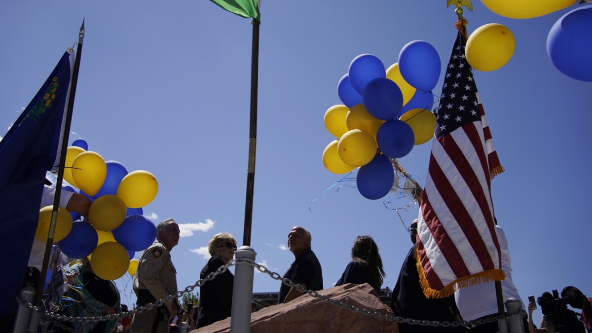 People watch as balloons are released during a ceremony to commemorate the 20th anniversary of the Sept. 11 terrorist attacks on Sept. 11, 2021, in Las Vegas. | John Locher, AP