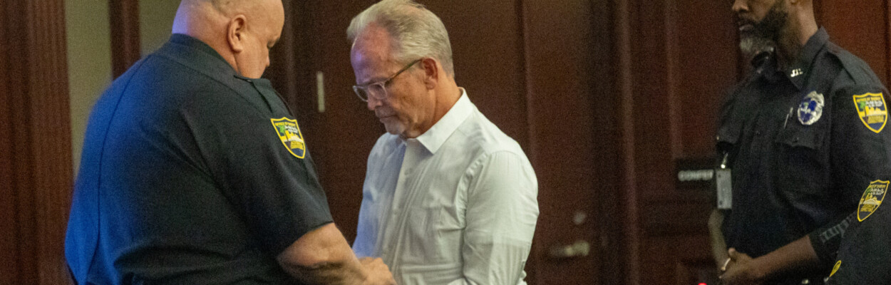 Jeffrey Clayton, a former vocal teacher at Douglas Anderson School of the Arts, is handcuffed after a judge sentenced him to 10 years in prison on Friday, June 14, 2024. | Will Brown, Jacksonville Today