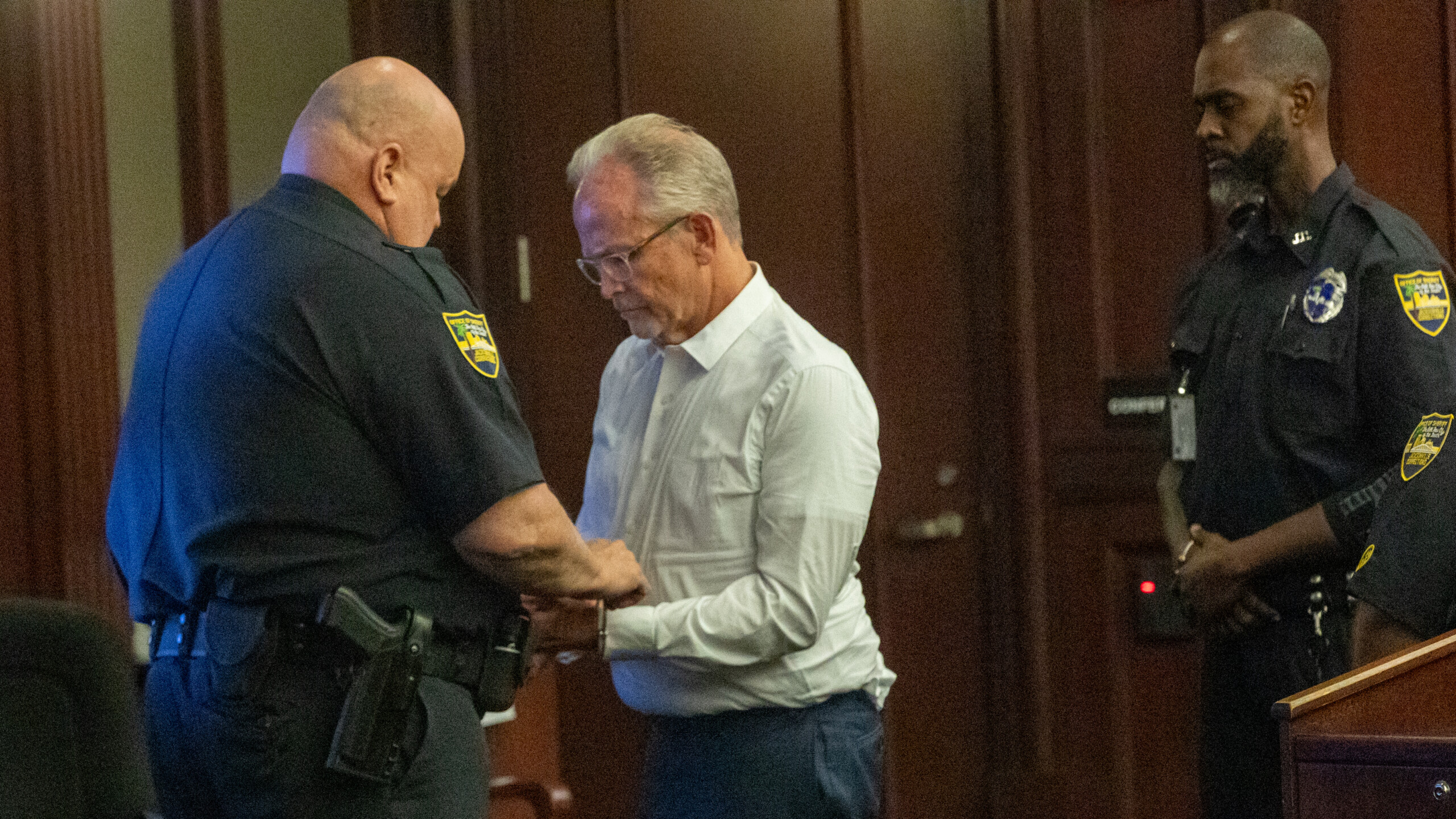 Jeffrey Clayton, a former vocal teacher at Douglas Anderson School of the Arts, is handcuffed after a judge sentenced him to 10 years in prison on Friday, June 14, 2024. | Will Brown, Jacksonville Today