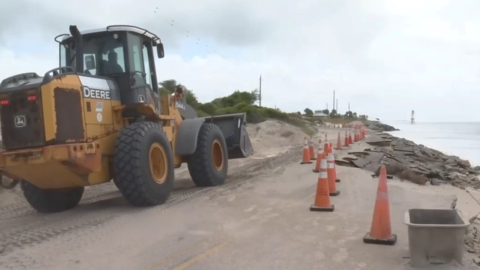 Workers rebuild the road at Huguenot Park. | News4Jax