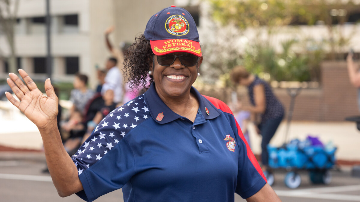 Pat McCullough served in the U.S. Marine Corps before working in politics and serving as the city of Jacksonville's special assistant to the mayor on civic engagement and youth participation. She is shown marching during the city's Veterans Day Parade on Nov. 11, 2023. | Will Brown, Jacksonville Today