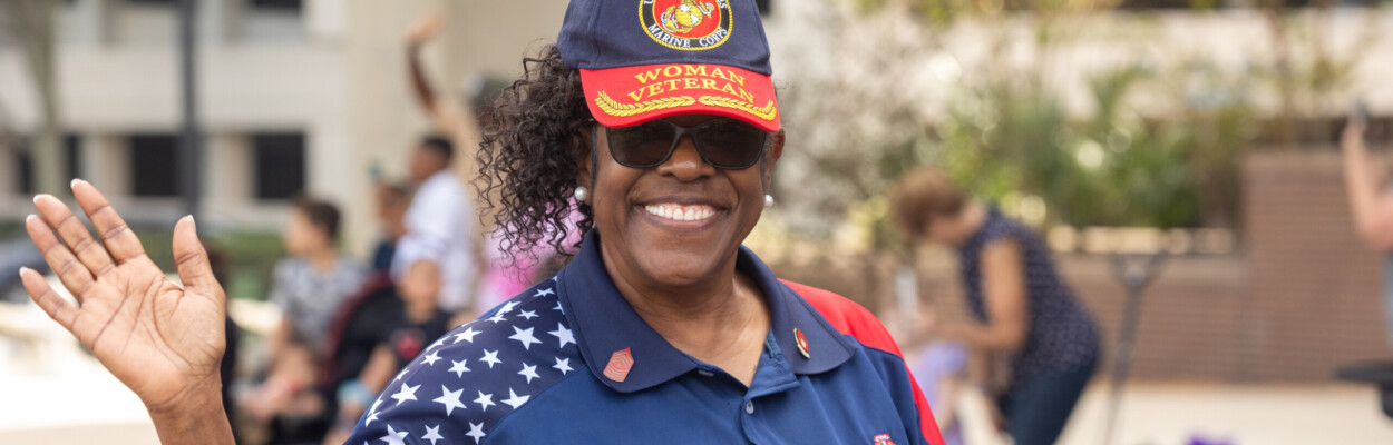 Pat McCullough served in the U.S. Marine Corps before working in politics and serving as the city of Jacksonville's special assistant to the mayor on civic engagement and youth participation. She is shown marching during the city's Veterans Day Parade on Nov. 11, 2023. | Will Brown, Jacksonville Today