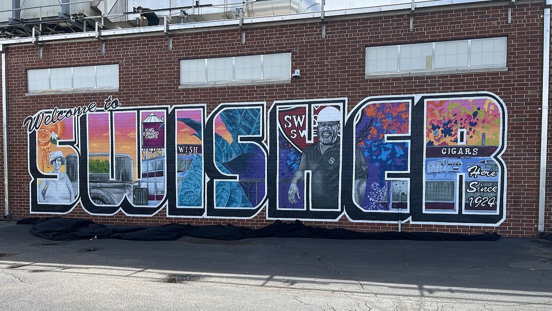 Swisher marked its 100th anniversary in Jacksonville with the unveiling of a mural at the entrance to its corporate headquarters. | Dan Macdonald, Jacksonville Daily Record