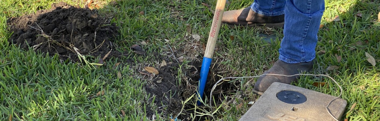 A JEA worker digs down to inspect a waterline. | JEA