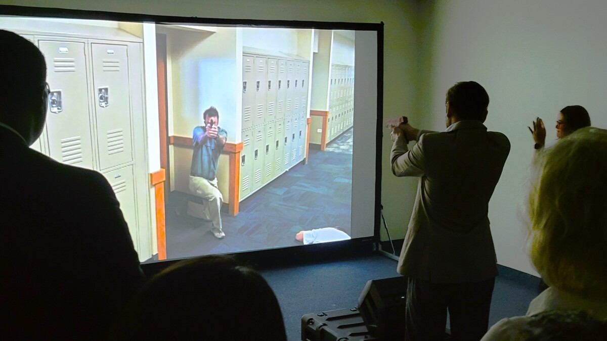 Justin Kunst takes aim at a simulated school shooter during a drill at Keiser University. | Dan Scanlan, Jacksonville Today