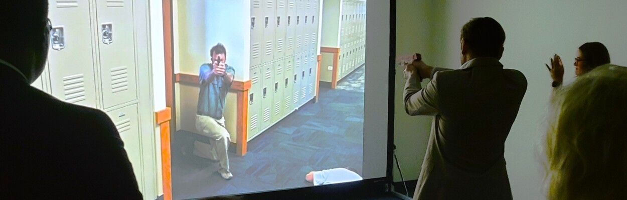 Justin Kunst takes aim at a simulated school shooter during a drill at Keiser University. | Dan Scanlan, Jacksonville Today