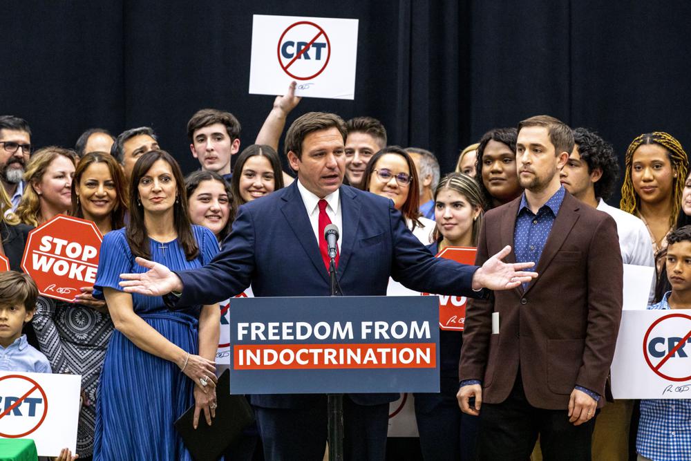 Gov. Ron DeSantis addresses the crowd before publicly signing HB7, "individual freedom," also dubbed the "stop WOKE" bill during a news conference at Mater Academy Charter Middle/High School in Hialeah Gardens on April 22, 2022. | Daaniel A. Varela, Miami Herald