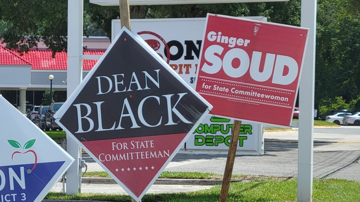 Campaign signs are posted at Bowden and Spring Park roads for two candidates for state committeeman and state committeewoman. | Dan Scanlan, Jacksonville Today