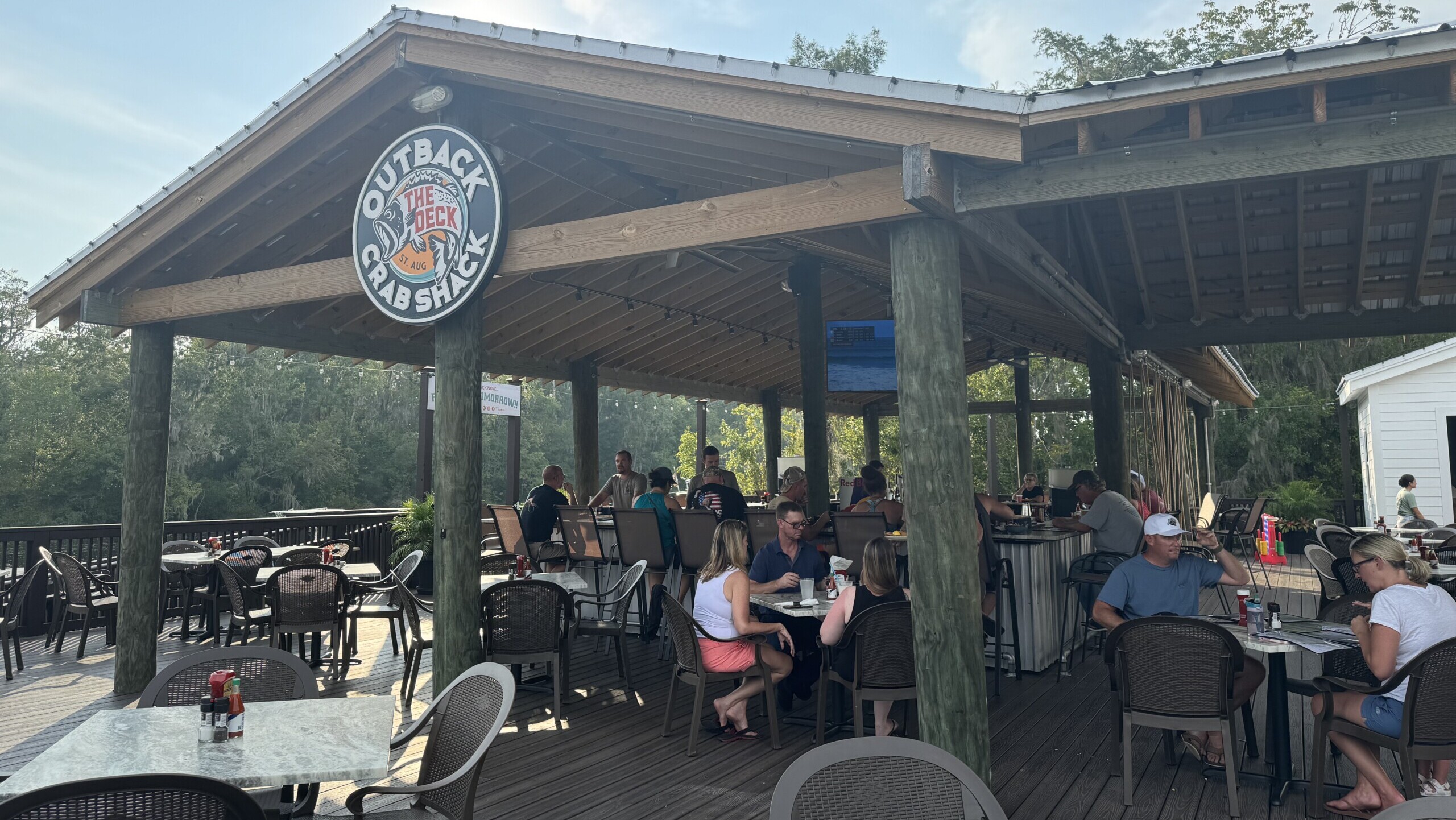 Diners sit out back of the Crabshack during its soft reopening. | Megan Mallicoat, Jacksonville Today