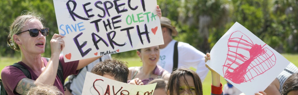 Protesters chant against a plan to develop state parks with business ventures such as golf courses, pickleball courts and large hotels, during a demonstration at Oleta River State Park on Tuesday, Aug. 27, 2024, in North Miami Beach. | Wilfredo Lee, AP