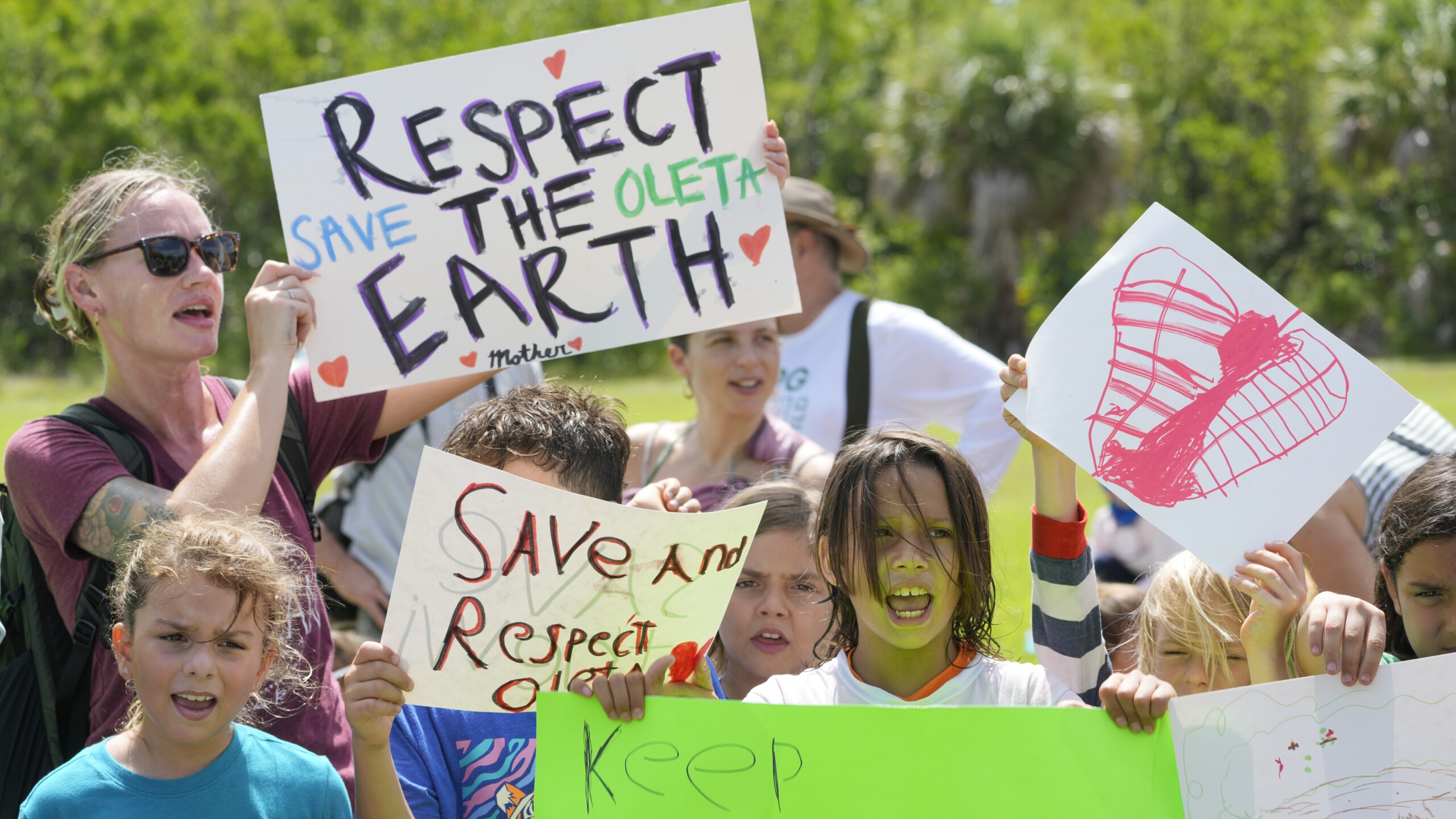 Protesters chant against a plan to develop state parks with business ventures such as golf courses, pickleball courts and large hotels, during a demonstration at Oleta River State Park on Tuesday, Aug. 27, 2024, in North Miami Beach. | Wilfredo Lee, AP