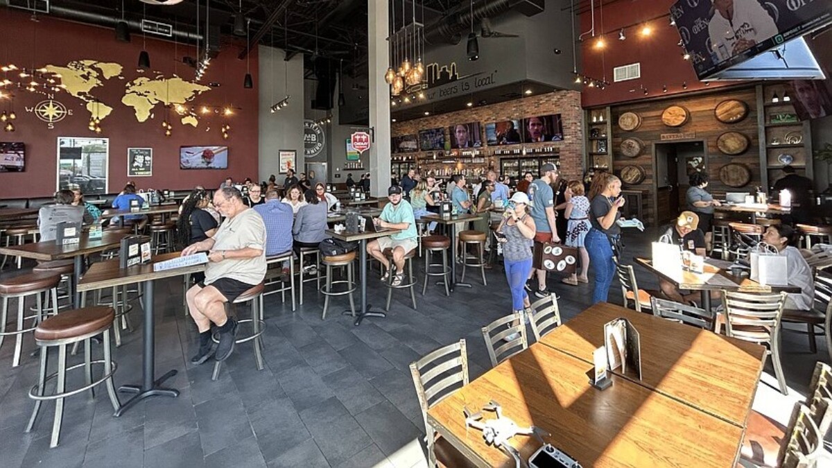 Customers attend the "grand reopening" of World of Beer Bar & Kitchen on July 16, 2024. | Jacksonville Daily Record