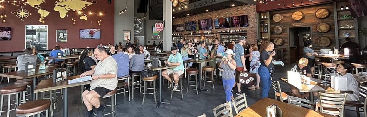 Customers attend the "grand reopening" of World of Beer Bar & Kitchen on July 16, 2024. | Jacksonville Daily Record