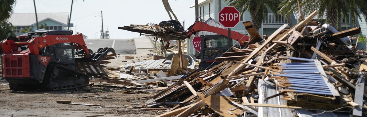 Workers remove debris from Hurricane Helene, in Cedar Key on Friday, Sept. 27, 2024. | Gerald Herbert, AP