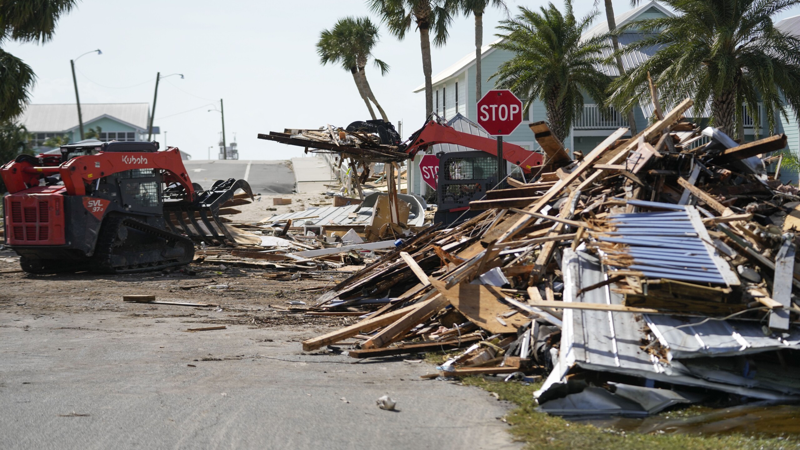 Workers remove debris from Hurricane Helene, in Cedar Key on Friday, Sept. 27, 2024. | Gerald Herbert, AP