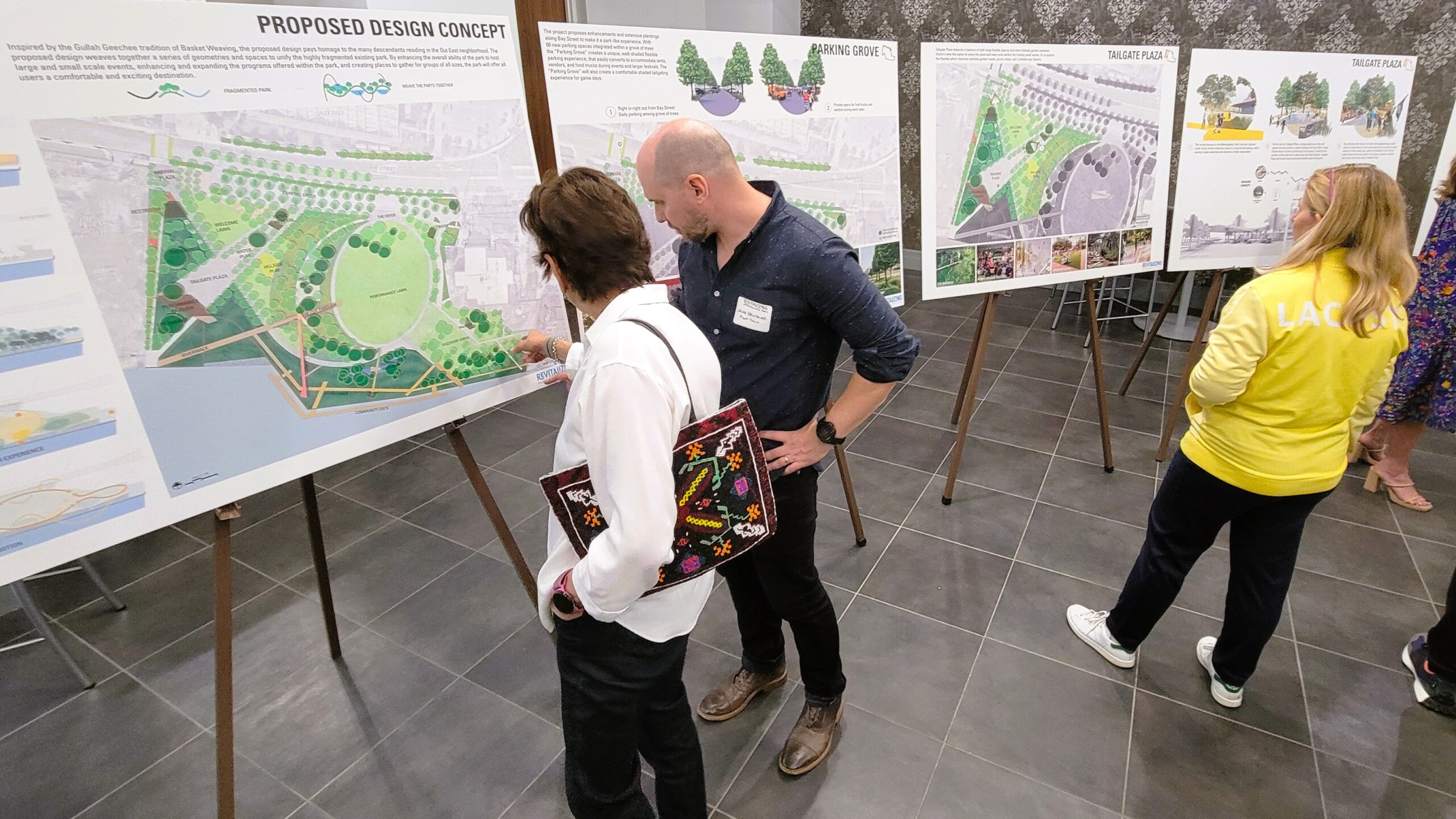 People look at the final design proposal for Metropolitan Park.