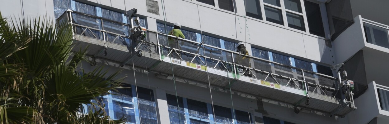 Workers repairing condo