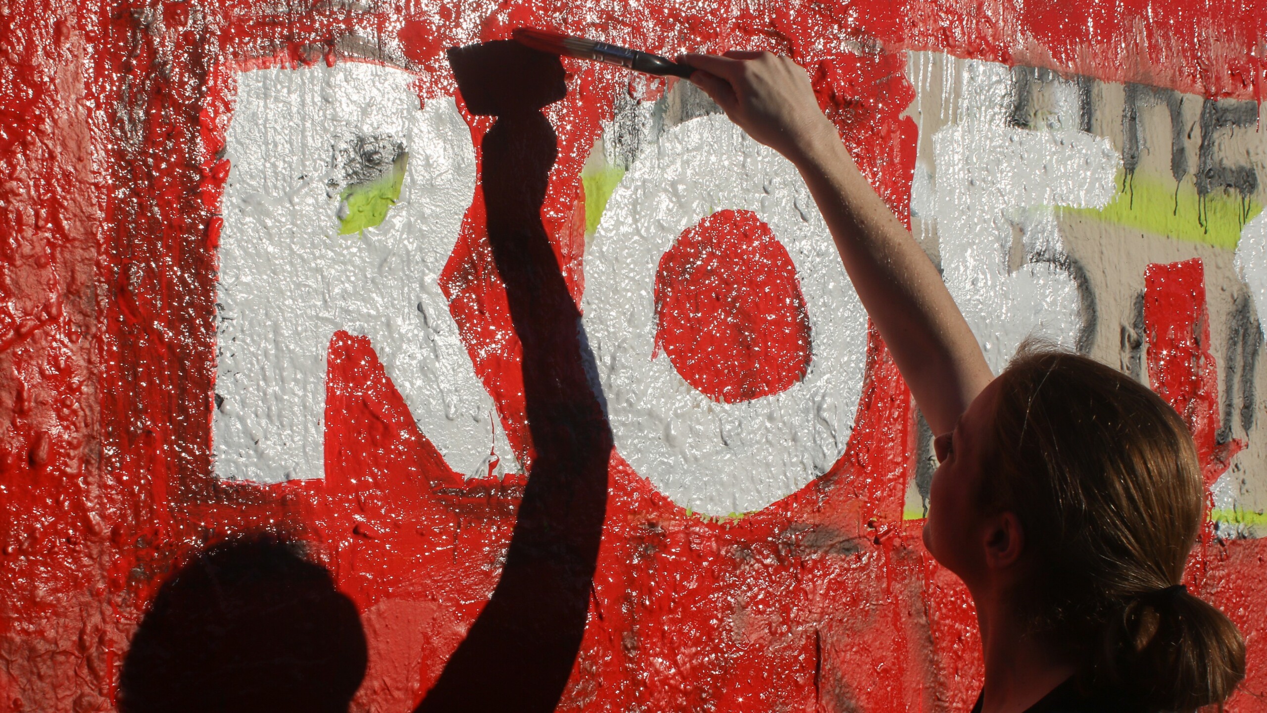 Abortion rights supporters paint a wall