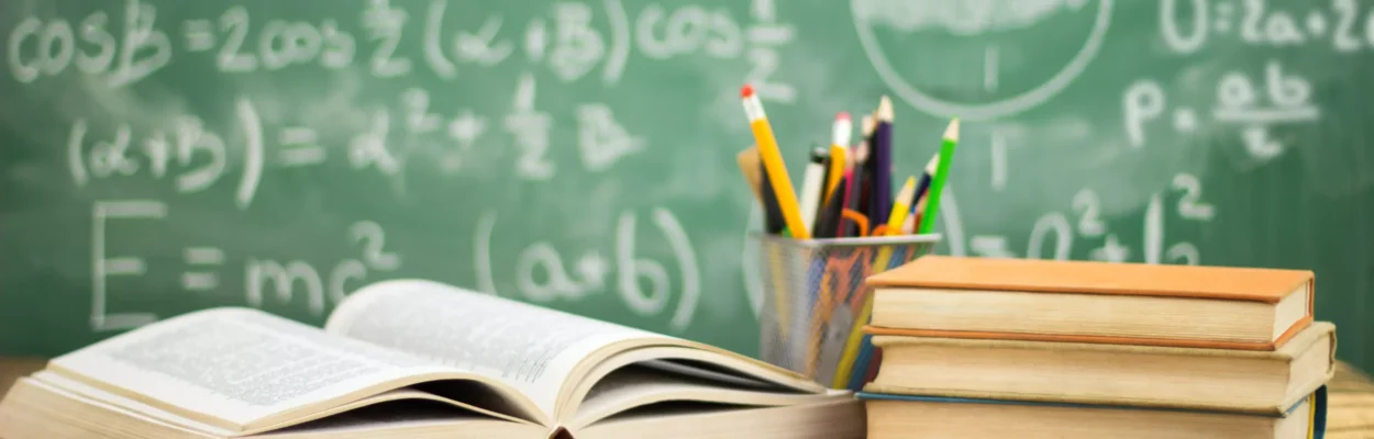School books on desk, education concept.