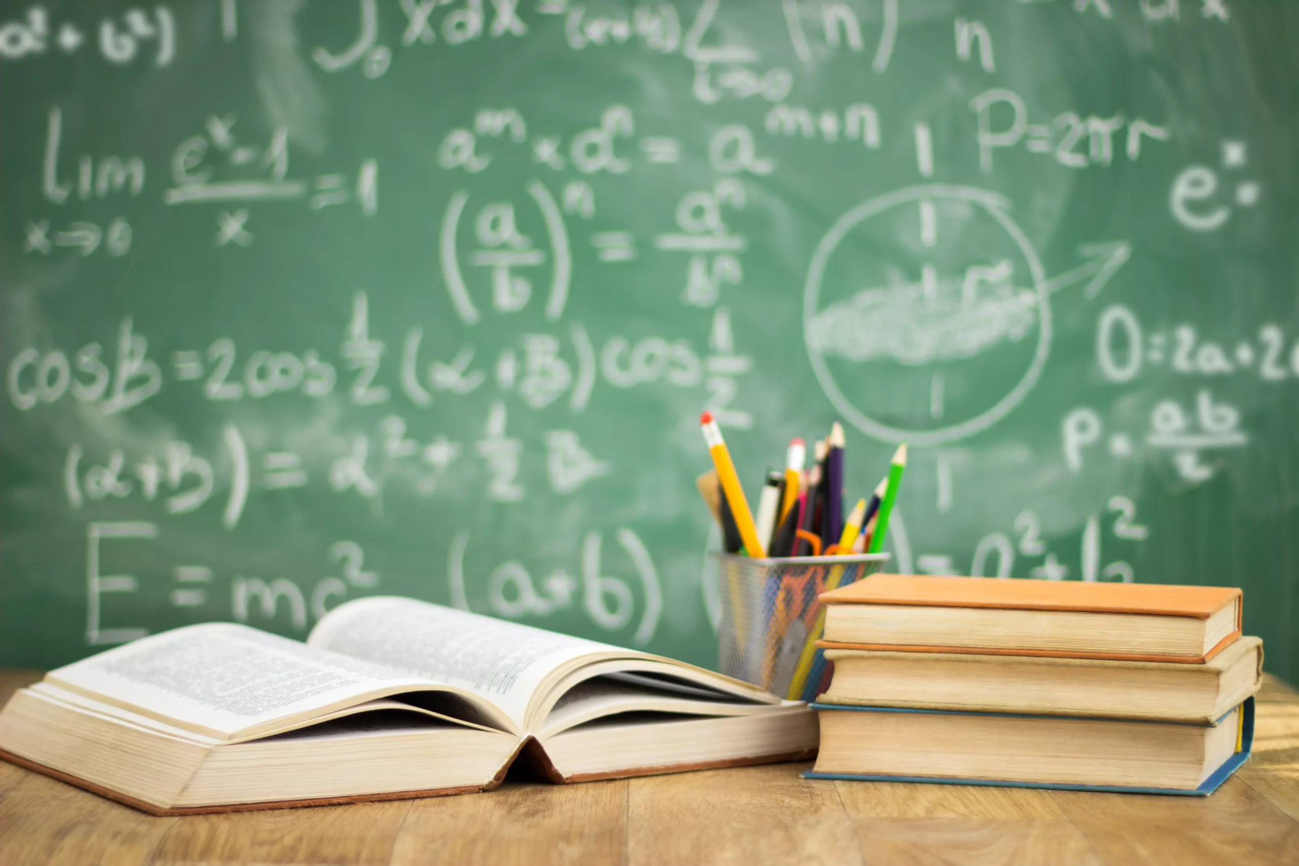School books on desk, education concept.