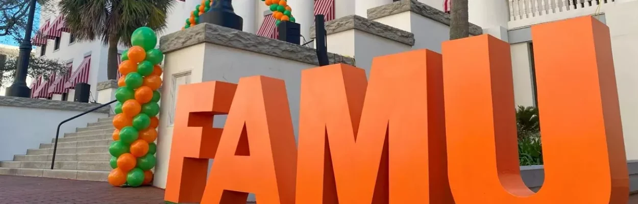Block letters spelling out "FAMU" in orange and green in the capital courtyard
