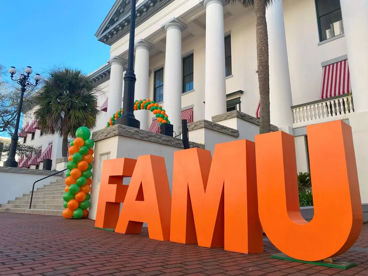 Block letters spelling out "FAMU" in orange and green in the capital courtyard