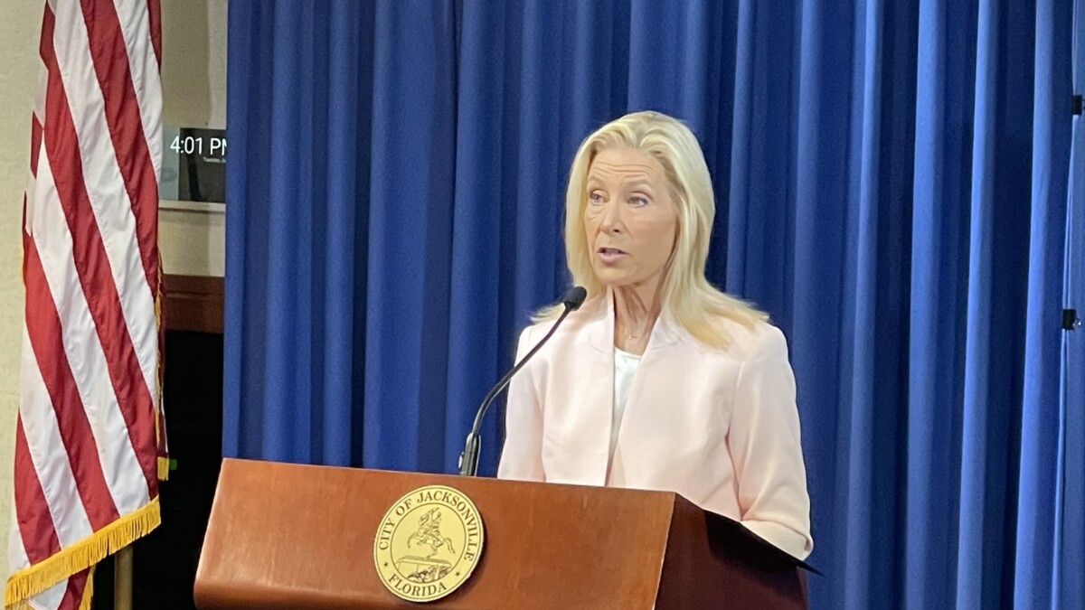 Mayor Donna Deegan speaks to reporters about her veto of a local immigration bill at City Hall.
