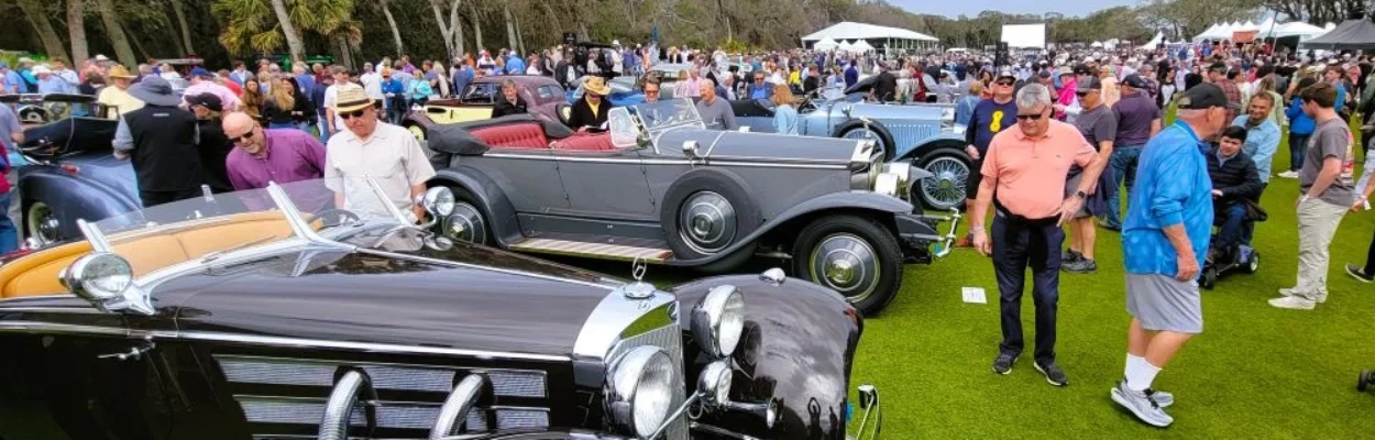Crowds look at the classic cars at The Amelia