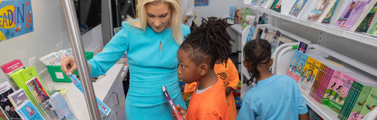 Mayor Donna Deegan with a child on a bookmobile