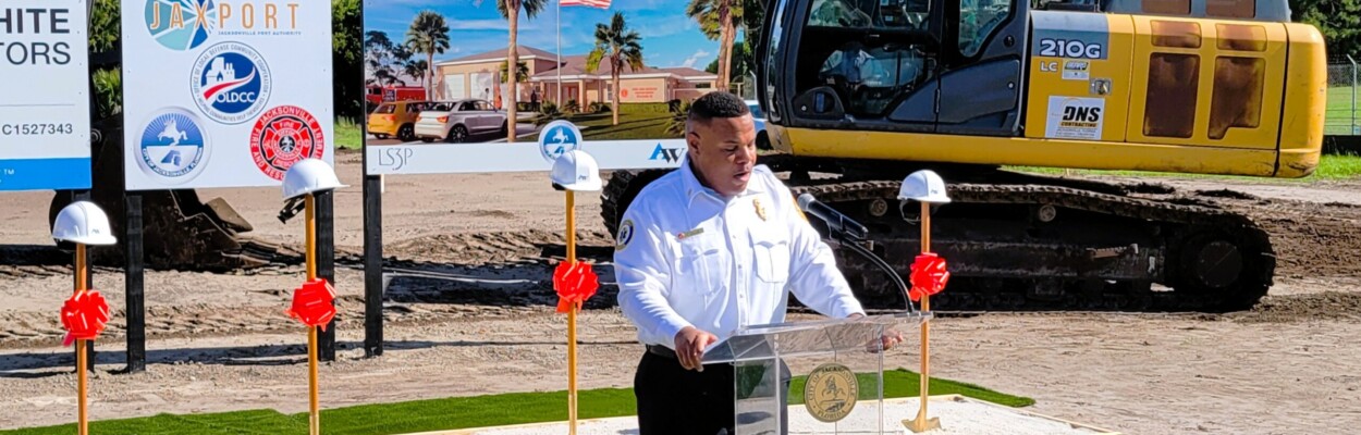 Jacksonville Fire Chief Percy Golden II speaking at a lectern.