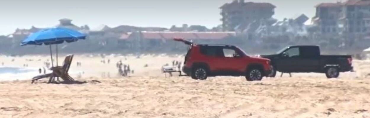 Vehicles parked on a beach in Nassau County