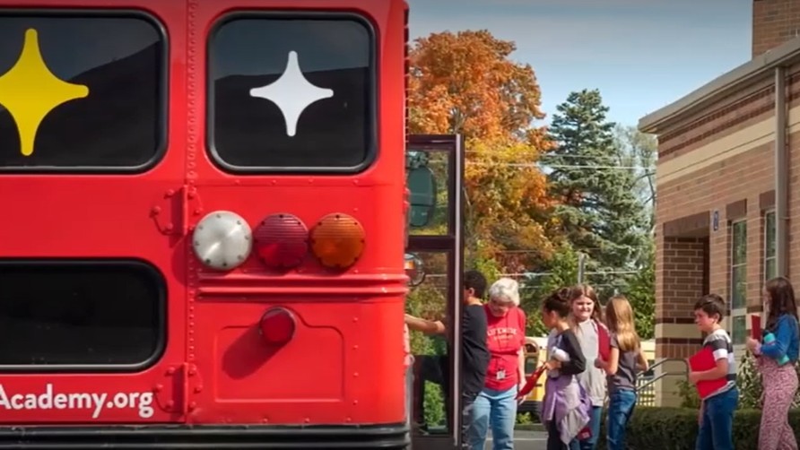 Students boarding a LifeWise Academy bus