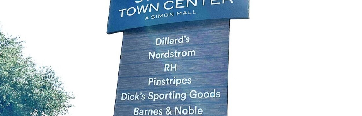 A sign at St. Johns Town Center shows the Pinstripes entertainment center.