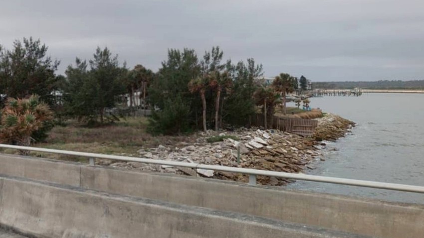Trees and rocks on the site of the former Matanzas Innlet Restaurant.