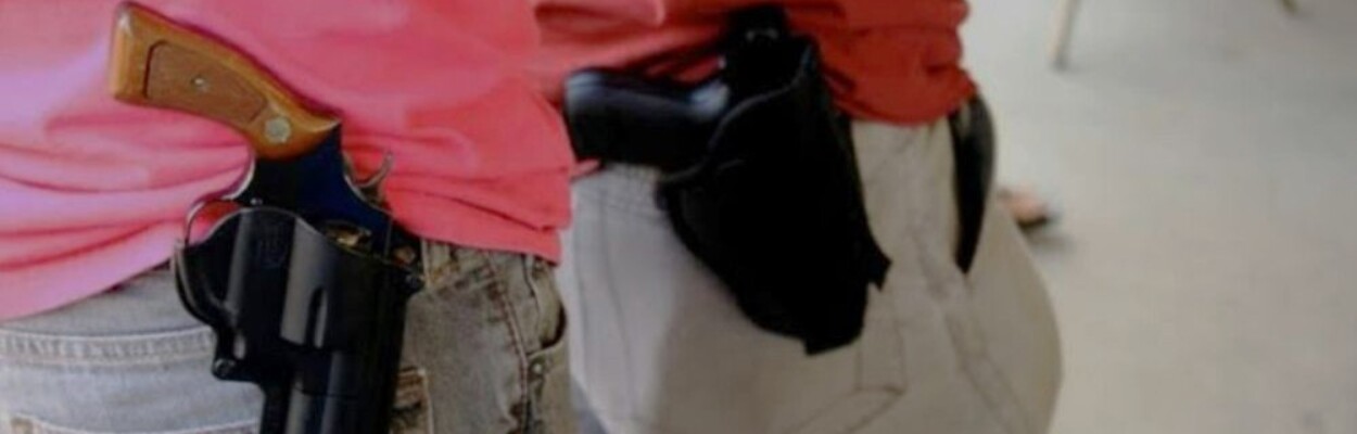 Guns are worn in holsters where open carry is allowed.