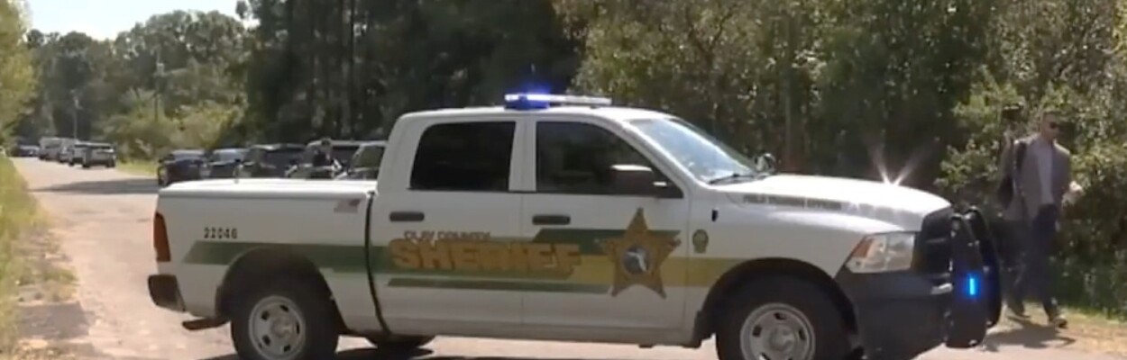 A Clay County police car parked at the shooting scene in Oakleaf.
