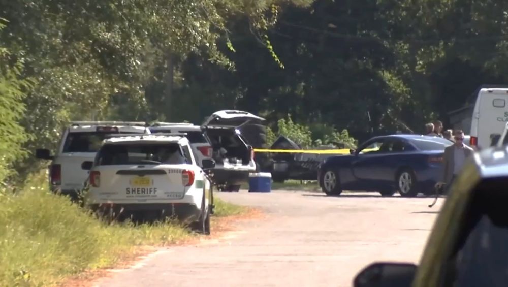Investigators work the shooting scene on Monday, Sept. 15 on Pine Oaks Lane. | News4Jax