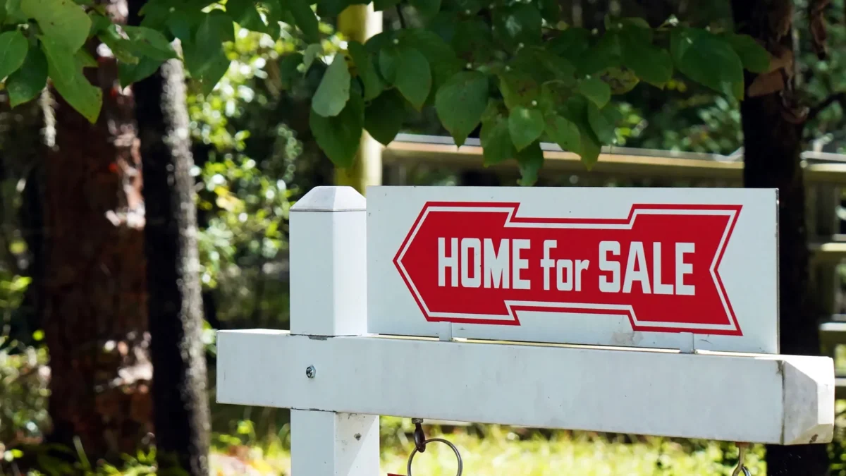 A sign advertising a home for sale during a debate about property taxes