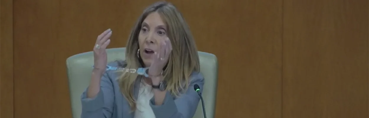 St. Johns County Commissioner Ann Taylor wears handcuffs to illustrate what she says is an attack on home rule.