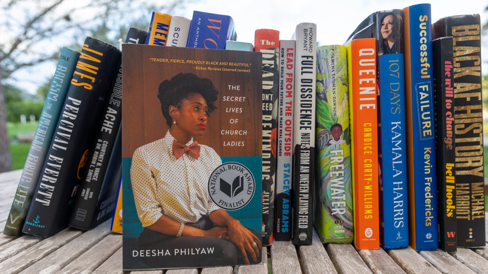 Books are lined up before the Black Book Bash.