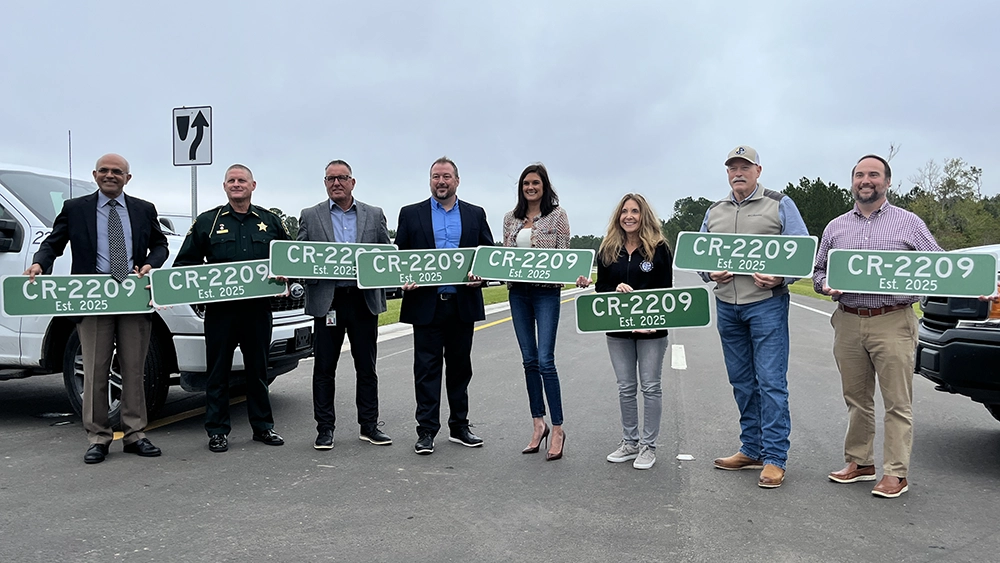 St. Johns County officials celebrate a new segment of County Road 2209.
