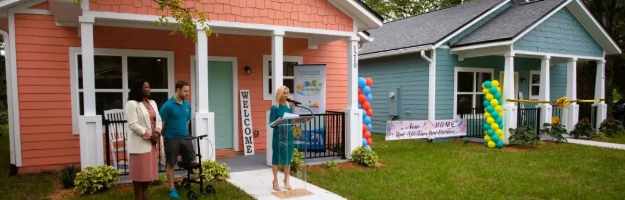 City officials speak in front of one of the new homes in Durkeeville.