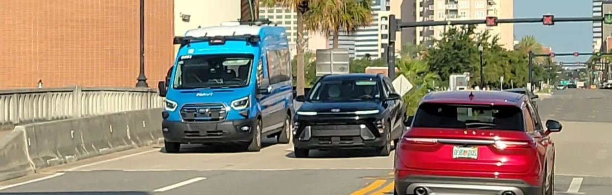 A NAVI autonomous shuttle in traffic