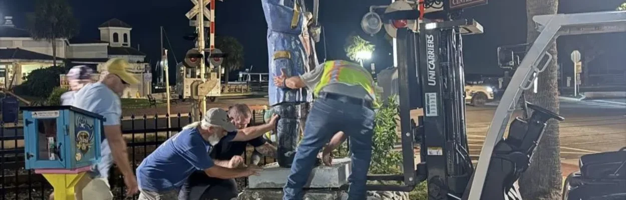 City crews and volunteers moving the deteriorated Peg Leg Pete statue