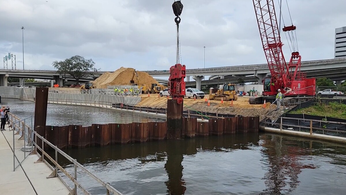 McCoys Creek flows into the St. Johns River again as a steel barrier between them is lifted.