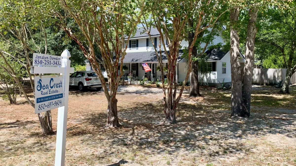 A home for sale as a UNF poll finds opposition to property taxes.