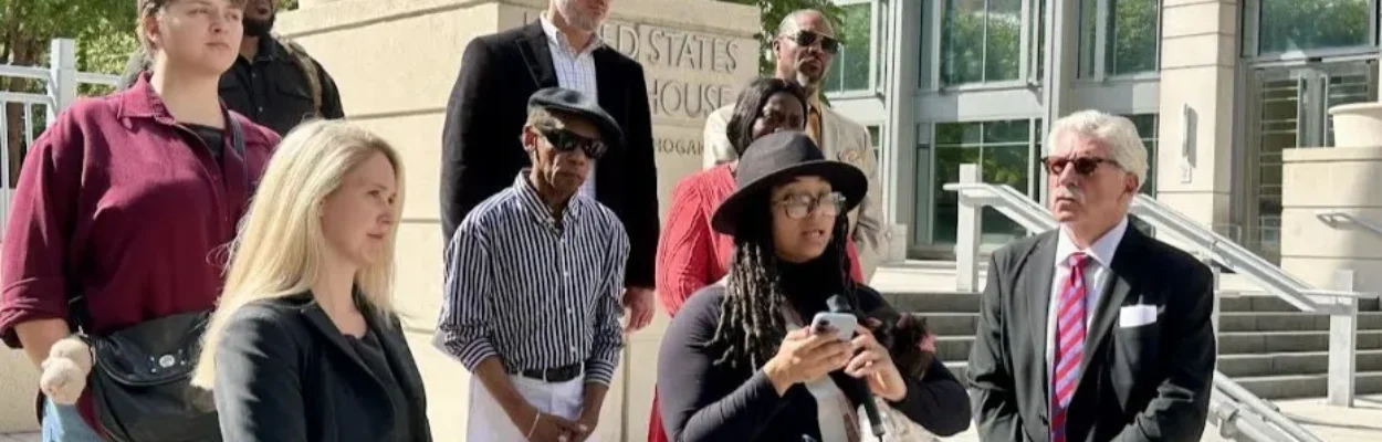 Representatives of a Black radio station in Pinellas County stand on courthouse steps in Jacksonville.