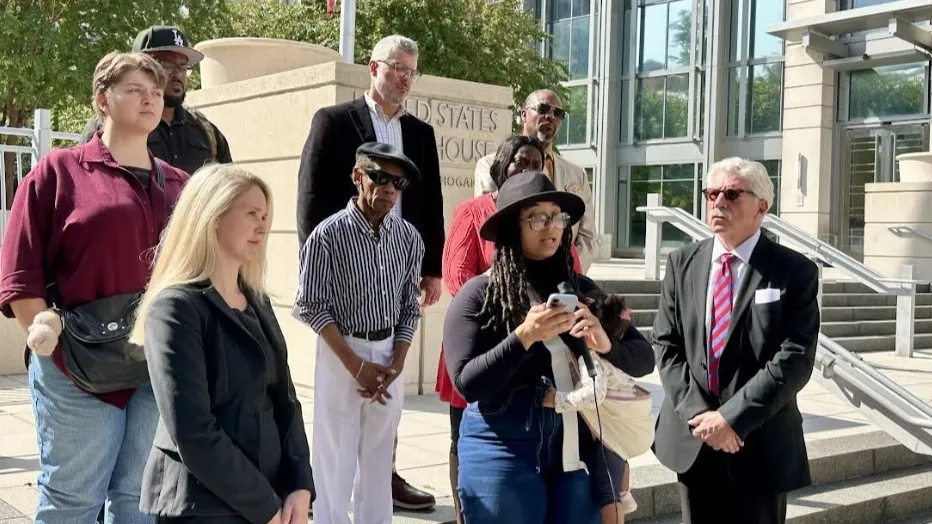 Representatives of a Black radio station in Pinellas County stand on courthouse steps in Jacksonville.