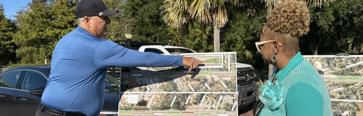 Project Manager Frank Anderson and City Councilwoman JuCoby Pittman discuss the road project.