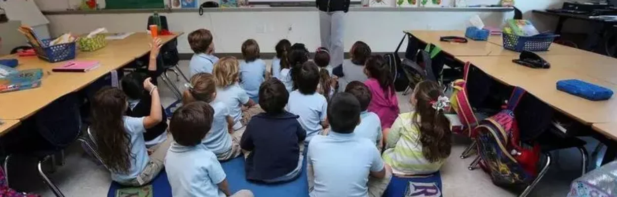 A classroom with students on vouchers